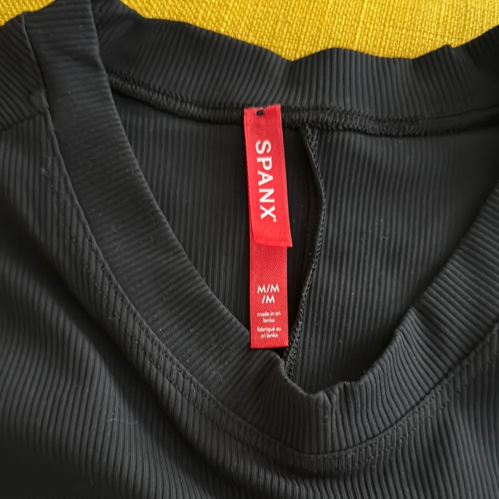 Spanx Black Ribbed Bodysuit. NWOT. Size medium.